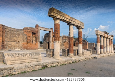 Stone and brick columns in The Forum in the archaeological excavations of Roman Pompeii near Naples, Campania, Italy.