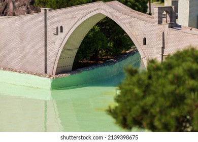 Stone bridge with arches over the water, public place in the city of Istanbul.