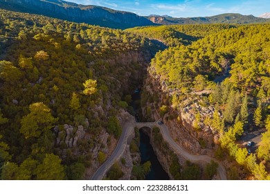 Stone bridge with river from Koprulu Tazi Canyon. Manavgat Antalya Turkey aerial top view. - Shutterstock ID 2232886131