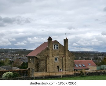 Stone Built House With Red Tiled Roof Two Chimney Stacks And Single Story Rear Extension Cloudy Sky Huddersfield Yorkshire England 27-04-2021 By Roy Hinchliffe