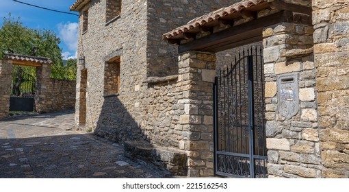 Stone Built Walls And Buildings Of A Typical Spanish Pyrenees Village Street 