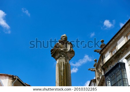stone bust on a column in homage to the Spanish writer Miguel de Cervantes