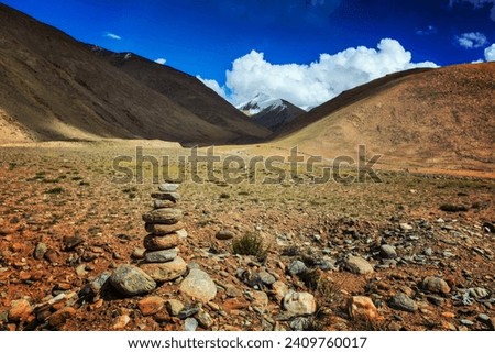Stone cairn at Namshang La pass in Himalayas. Ladakh, India
