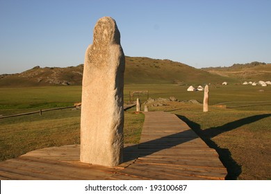 Stone Carved Monoliths Left By The Army Of Ghengis Khan Stand Guard In The Mountains Of Kanas, China