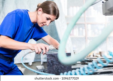 Stone Carver Working On Gravestone With Compressed Air Chisel