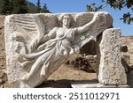 The stone carving of the goddess Nike at Ephesus archaeological site, Turkey. Ephesus was built in the 10th century BC on the site of the former Arzawan capital by Attic and Ionian Greek colonists