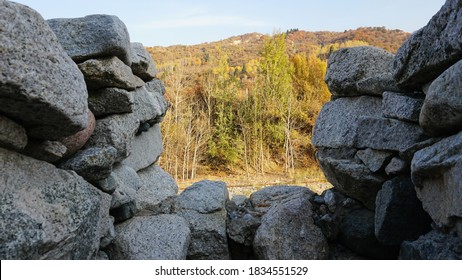 Stone Castle, Near The Walls And Inside. Huge Stone Walls Of The Fortress. Layer Of Cement And Sand. There Are Tools For Construction. View Of The Forest, Mountains From The Fortress. Small Window.