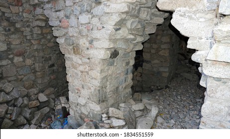 Stone Castle, Near The Walls And Inside. Huge Stone Walls Of The Fortress. Layer Of Cement And Sand. There Are Tools For Construction. View Of The Forest, Mountains From The Fortress. Small Window.