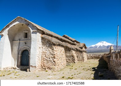 Stone Church Of The Village Of Sajama. The Small Andean Town Of Sajama, Bolivian Altiplano. Its Main Economic Activity Is Llama Grazing And Mountain Tourism. South America