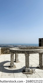 Stone circle table overlooking vast horizons, evoking ancient solstice rituals and cosmic gatherings in ethereal seascape realms