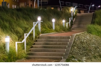 stone city staircase going up with light lanterns urban cityscape scenery of the streets at night - Powered by Shutterstock