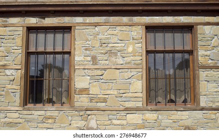 Stone cladding plates on the wall with two window