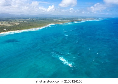 Stone cliff washes with Atlantic ocean. Macao beach. Dominican Republic. Aerial drone view