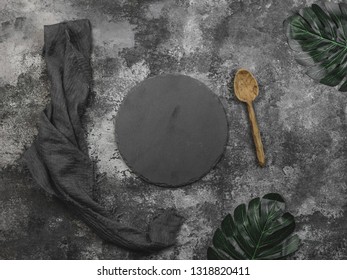 Stone Coaster, Napkin And Wooden Spoon With Grunge Background