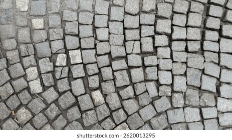 Stone cobblestone pavement texture, urban design, European architecture, rustic paths, medieval streets, historic paving pattern background