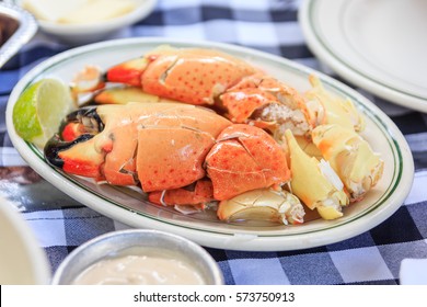 Stone crab claws with lemon butter and mustard on a plate as photographed in south beach miami florida