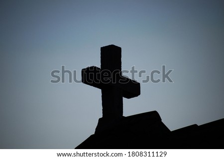 Stone Cross on a Church