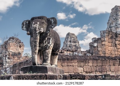 Stone elephant in front of ancient Cambodian temple ruins in Angkor complex, Siem Reap, Cambodia - Shutterstock ID 2129178287