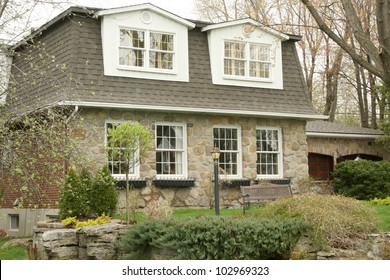 Stone Executive Cottage With Mansard Roof