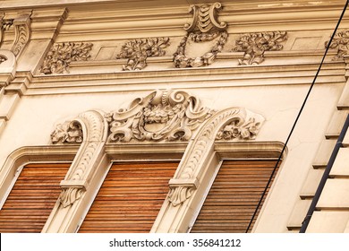 stone facade on classical building with ornaments and sculptures