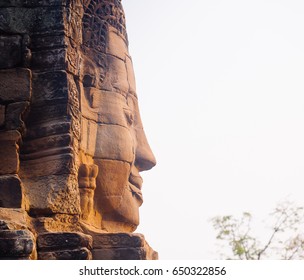 Stone face statue in ancient Bayon Temple Angkor Thom, Cambodia. Ancient monument Khmer architecture. - Shutterstock ID 650322856