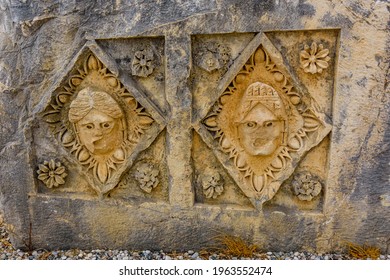 Stone faces bas relief at Myra ancient city. Demre, Turkey
