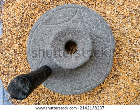 Stone flour mill or ancient hand flour mill, ancient grain  hand grinding millstone, stone grinder, one wheels windmill, old stone mills, traditional stone grinding mills