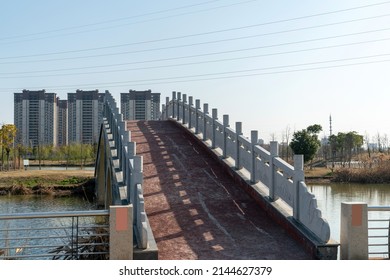 Stone Footbridge In An Asian Garden