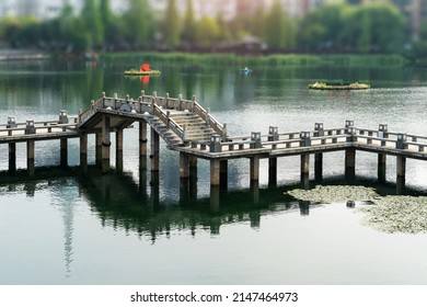 Stone Footbridge In An Asian Garden