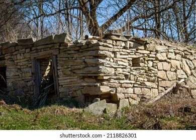 Stone foundation of abandoned old 19th-century house in Slovak mountain village - Shutterstock ID 2118826301