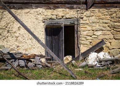 Stone foundation of abandoned old log house in Slovak mountain village - Shutterstock ID 2118826289