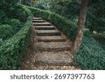Stone Garden Path. Rustic Steps through Greenery