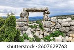 A stone gateway, commonly found in many ancient settlements of Ancient Cilicia, is located within the ruins of Sakizlik, in the Sağlıklı neighborhood of Tarsus, Mersin.