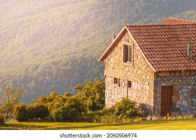 A stone house in the mountains is a refuge for tourists and hikers. The concept of travel and real estate - Powered by Shutterstock