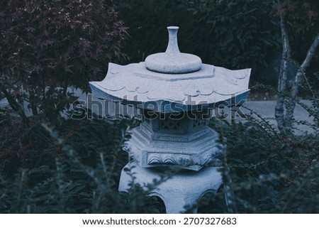 Stone lantern, creating a tranquil and meditative scene in a traditional Japanese garden