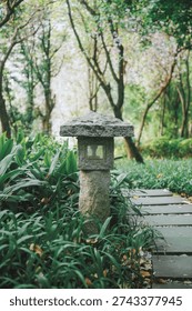 A stone lantern on the pathway.