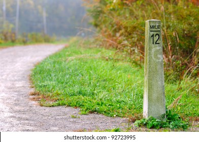 Stone Mile Marker On A Hiking/jogging Trail