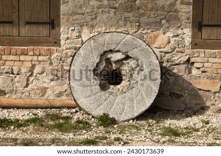 stone millstones of an old mill.