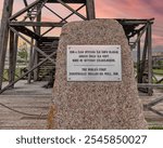 A stone monument marks the location of the worlds first industrially drilled oil well in Baku, Azerbaijan, drilled in 1846, showcasing its historical importance and the evolution of the oil industry