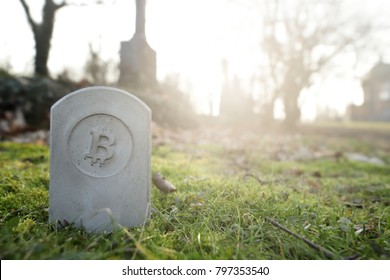 Stone Monument/tombstone With Bitcoin Symbol Standing In Green Grass On Cementery - Wide Angle View - Sunny Blurred Background With Space For Text - Economic/financial Concept