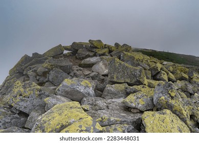 Stone mounds in the mountains. Breaks in the mountains. Mountains in the clouds. Carpathians in summer. Mountains of Ukraine.
