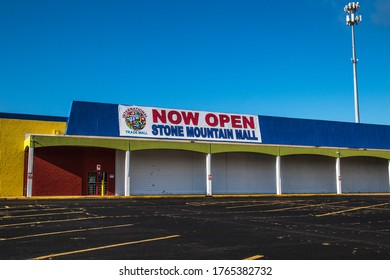 Stone Mountain, Ga USA - 06 28 20: Retro Vintage Colorful Retail Strip Mall Now Open Sign Empty Parking Lot Memorial Drive