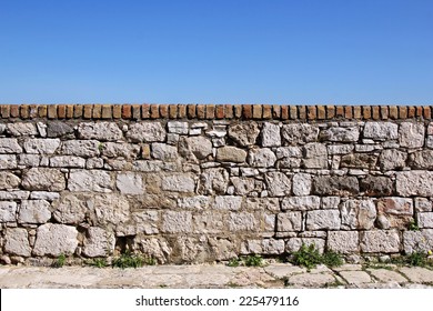 stone old wall with sky in the background