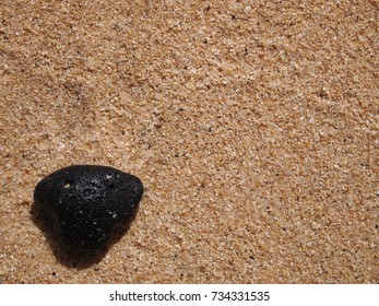 stone on sandy beach