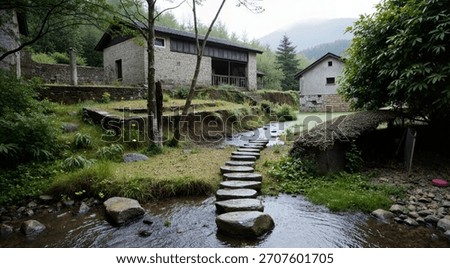 A stone path leading to a stone building next to a stream