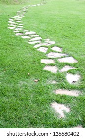 Stone path on green grass