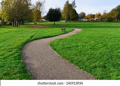 Stone Path through a Peaceful Green Park - Powered by Shutterstock