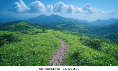 A stone path winds through a lush green hillside, leading the viewer towards a range of majestic mountains in the distance. 