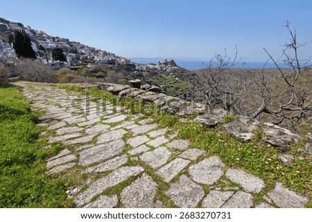 Stone paved path by the town of Ioulida, in Kea island, Cyclades, Greece, Europe. This path leads to the famous Lion of Kea, an archaic sculpture of 6th c. BC.