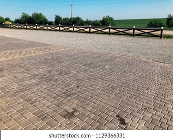 Stone pavement in perspective. Stone pavement texture. Granite cobblestoned pavement background. Abstract background of a cobblestone pavement